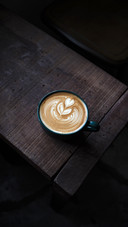 A cup of coffee latte with a beautiful latte art view on top