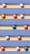 The blue railing is different from the small balls