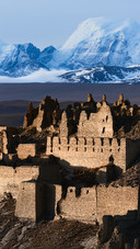 Abandoned Castle And Snowy Mountains in The Distance