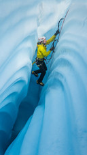 Man is Climbing on The Glacier