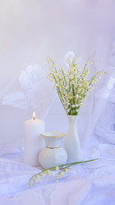 Still Life with Lilies of the Valley in a Vase and a Candle