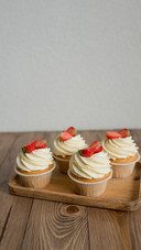 Pastries decorated with strawberries on the table