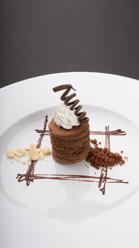 Decorated truffle chocolate dessert candy on white plate
