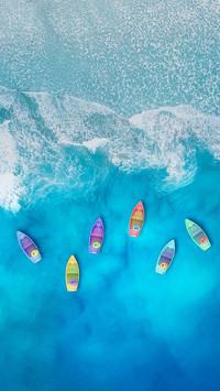 Some Boats Floating on The Blue Sea