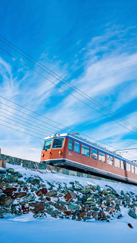 Red train moving towards gornergrat station