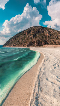 Blue waves and sandy beach