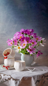 Modern still life with porcelain cups and a bouquet