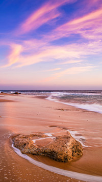 Sunset at Trafalgar lighthouse beach in Caños de Meca