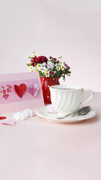 Pink invitation card decorated with paper hearts