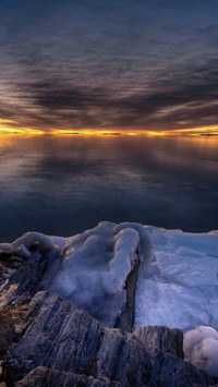 Dawn breaks on the frozen lake