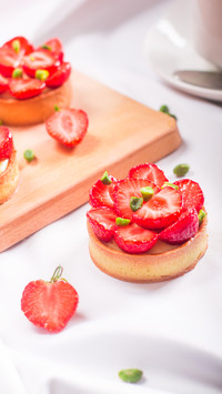 Delicious desserts with strawberries on table