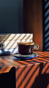 Coffee Cup on a Brown Table