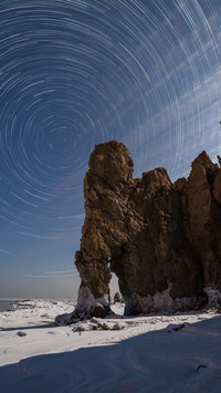 The star trail of elephant trunk hill in dalian