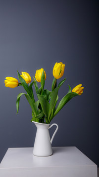 Green Leaves, Yellow Blooms - A Table's Graceful Centerpiece
