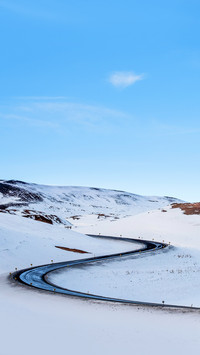Winter road landscape, with blue clear sky in Iceland