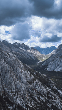 Climbing the steep cliff one aims for the summit of the
