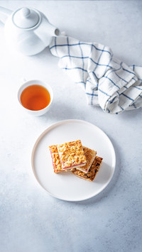 Sweet shortbread cookies with berry jam in a plate