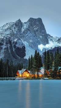 Night lights of a lake house in the mountains