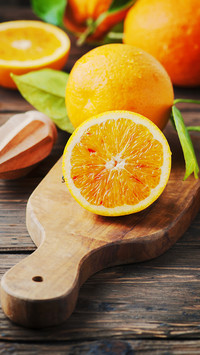 Fresh sweet oranges on the wooden table