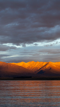 Mirage of majestic mountains on the sea surface