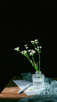 Vintage wildflowers and pens on the table