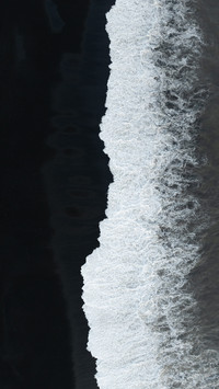 Between black and white the ocean tide keeps surging