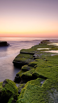 The layered rock walls are paired with a gradient blue