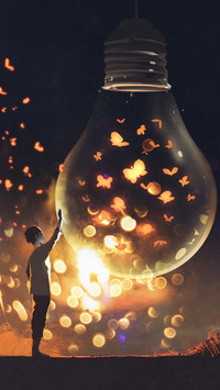 man and big bulb with glowing butterflies inside