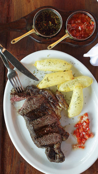 Beef steak with chips and salsa argentina