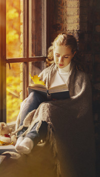 Beautiful Girl Reading by The Window