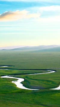The meandering river on the grassland