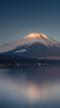 The first light of morning appears on Mount Fuji