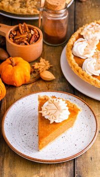 Traditional pumpkin pie for Thanksgiving topped
