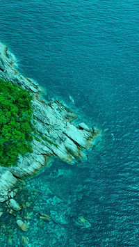 The sea meets the sky and the rocks are slanting