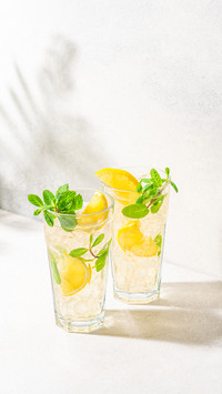 Refreshing drink with ice, lemon and mint