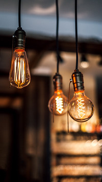 Vintage light bulbs hanging from the ceilings, close up view