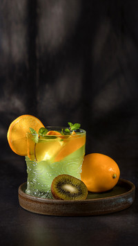Glasses with lemonade or mojito cocktail with lemon