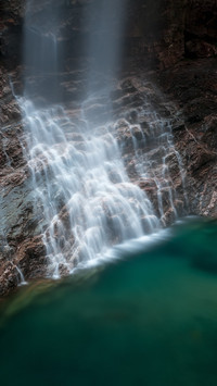 The water in the deep valley is clear by itself