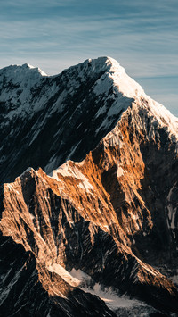 Morning light shines on the crest of the Hengduan Mountains