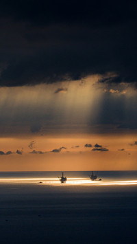 The first light of dawn shines on the clouds