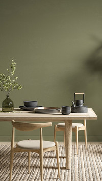 Green interior with dining table and decor