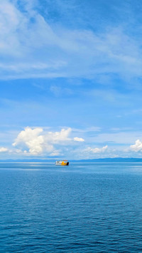 Ferry ship sailing in the middle of the sea
