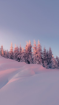 Majestic Wintry highlands with colorful sky during sunset