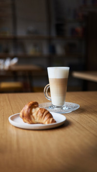 Coffee and croissant on the table