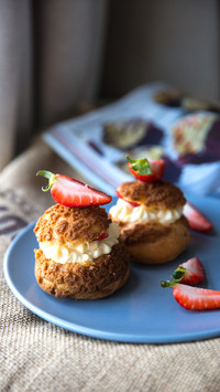 Fresh choux cream pastry or cream puff with cream