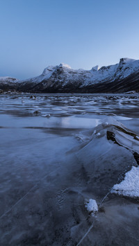 Frozen mountain lake still as a painting