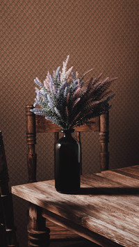 Beautiful bouquet of lavender flowers in a black glass