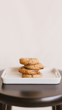 A vertical shot of freshly-baked chocolate cookies