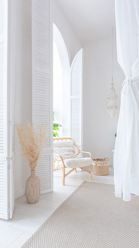 A Bright Apartment with White Walls and Bamboo Furniture