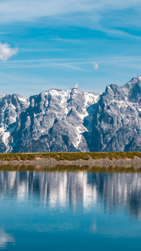 Majestic Snowy Peaks Mirrored in Deep Blue Lake